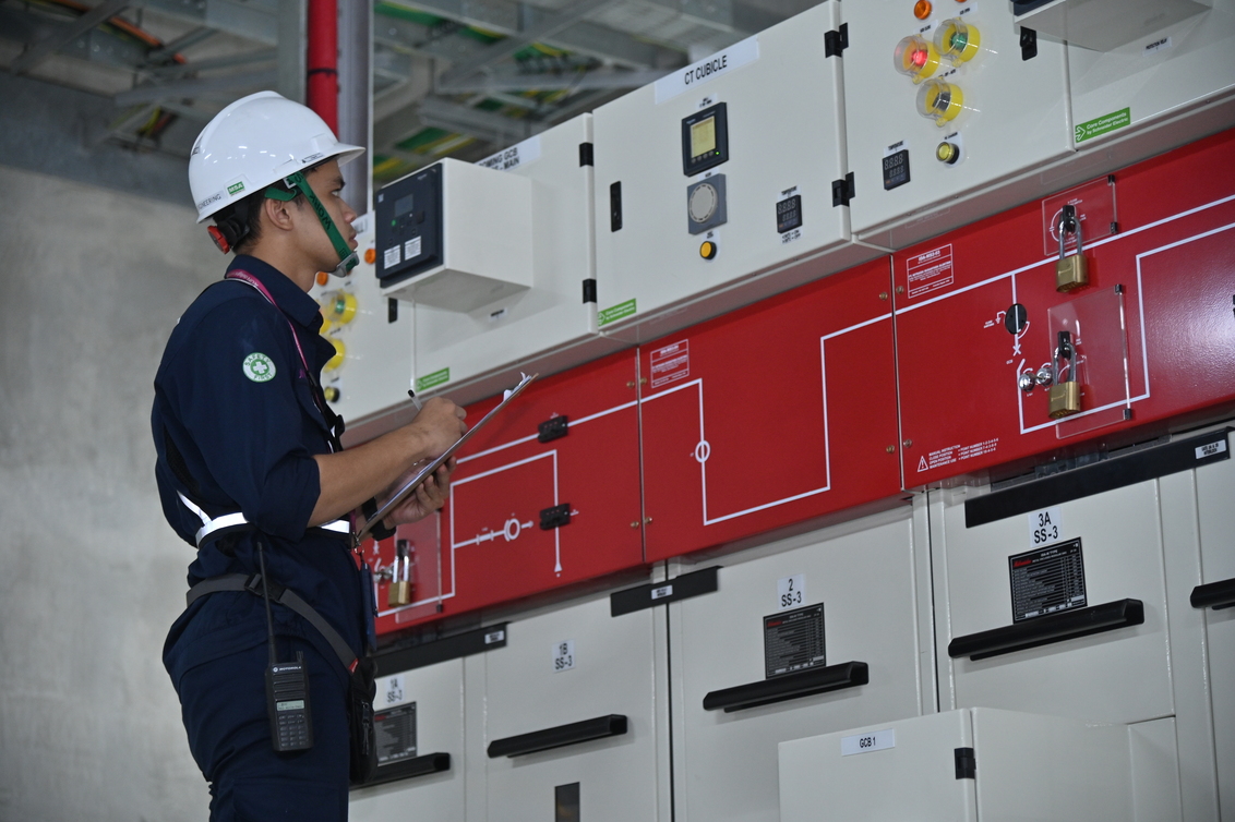 Technician checking electrical assets